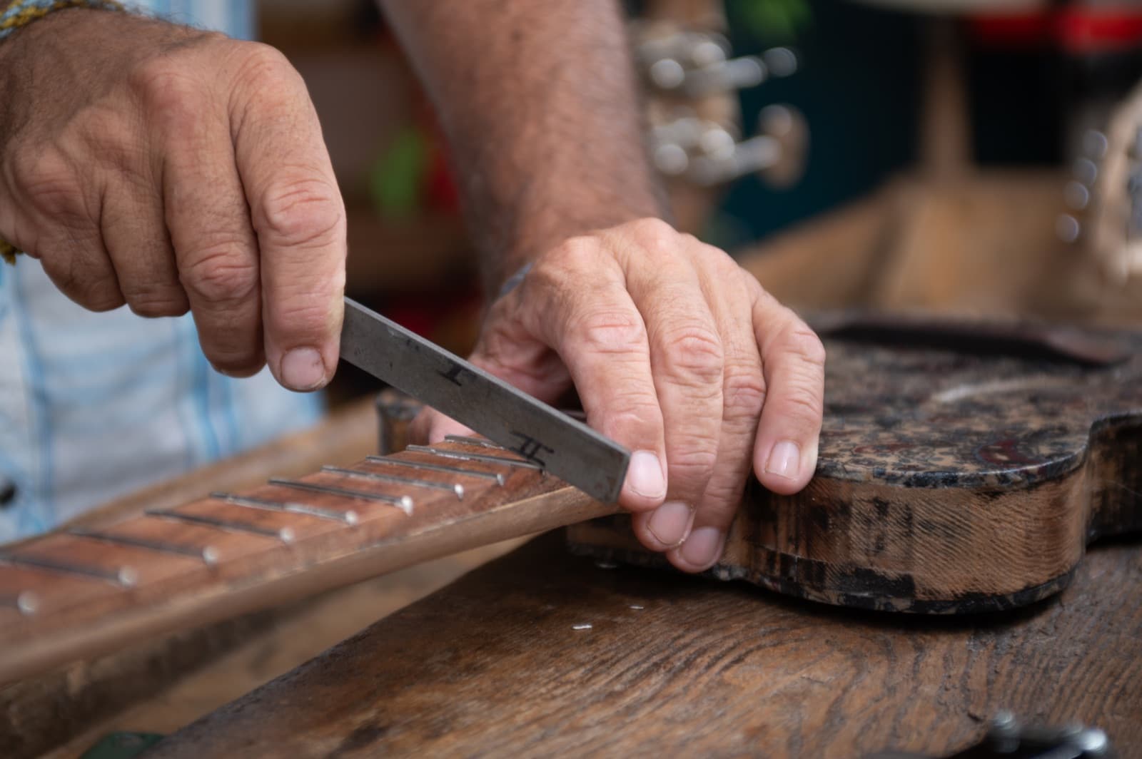 Shaping frets by hand